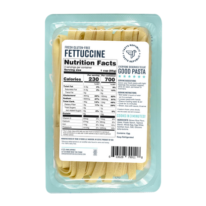 Taste Republic gluten-free fettuccine pasta in a 6-pack, showcasing uncooked, fresh, ribbon-shaped pasta on a white surface.