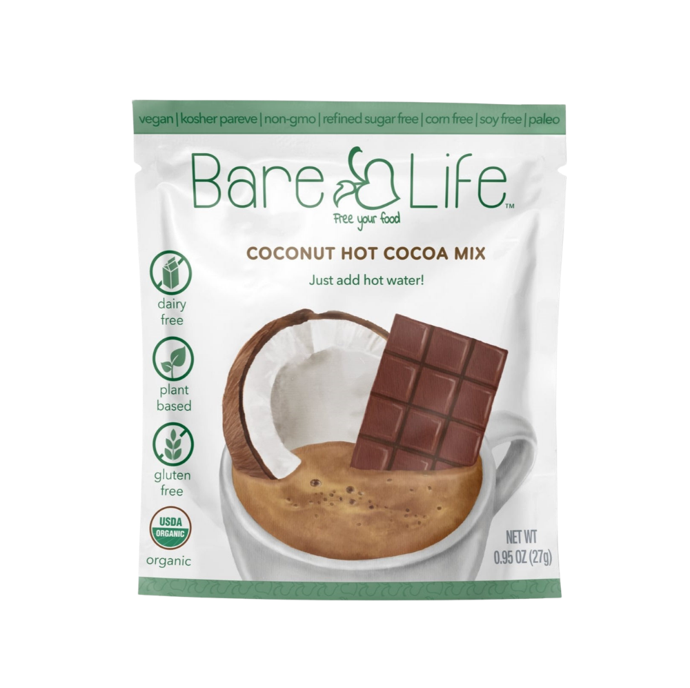 Bare Life dairy-free coconut hot cocoa mix single serving packets, showing the packaging with cocoa powder and coconut flavor.