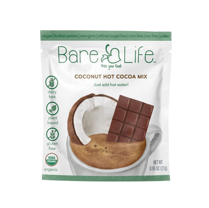 Bare Life dairy-free coconut hot cocoa mix single serving packets, showing the packaging with cocoa powder and coconut flavor.