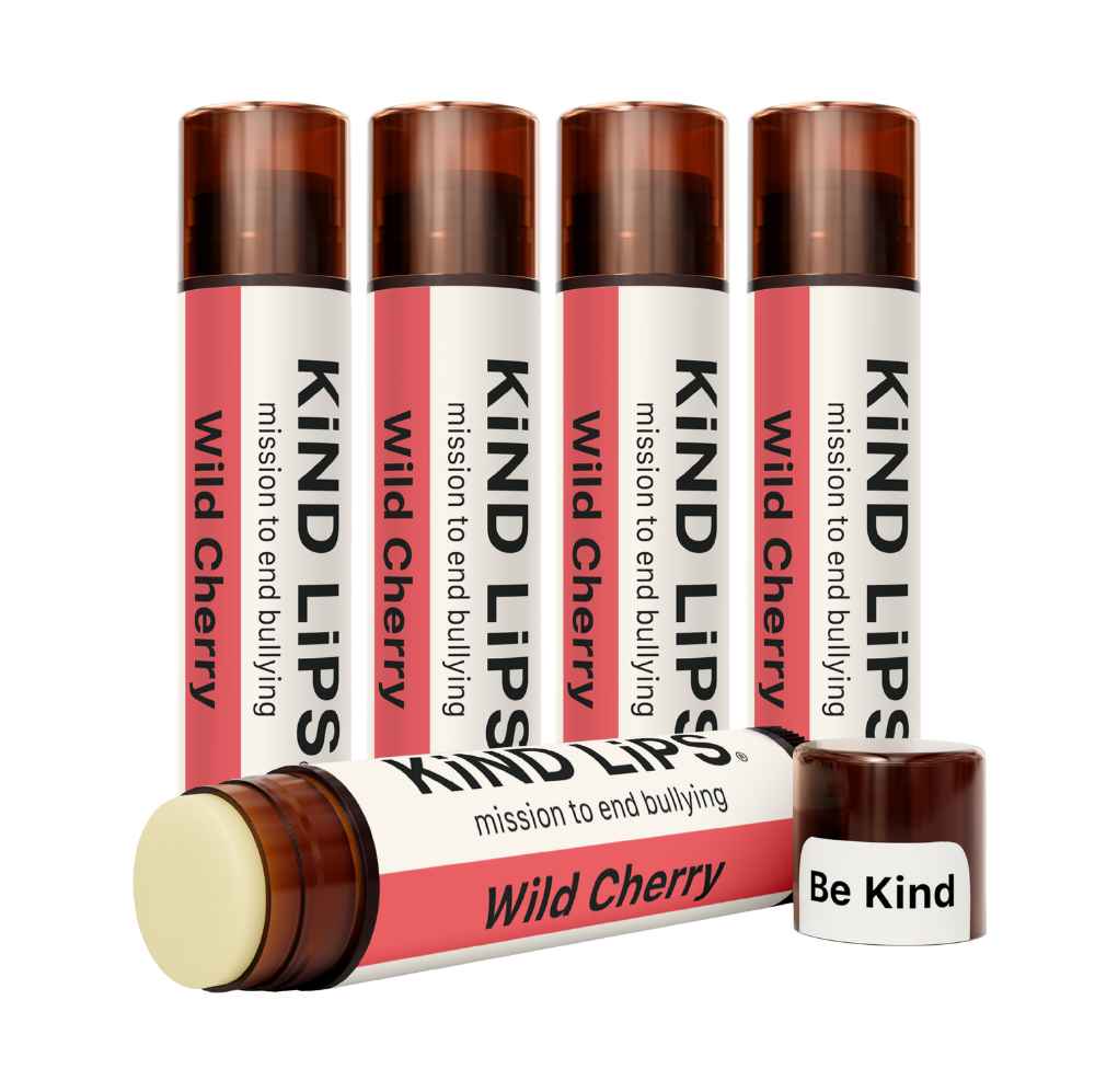 Kind Lips Wild Cherry organic lip balm tube with cherry flavor and natural ingredients, displayed against a white background.