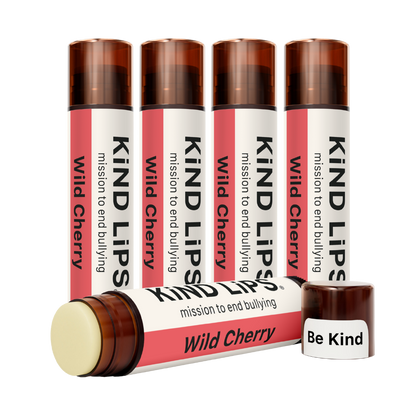 Kind Lips Wild Cherry organic lip balm tube with cherry flavor and natural ingredients, displayed against a white background.