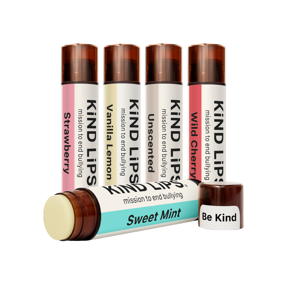 Assorted organic lip balm tubes from Kind Lips Variety Pack, showing colorful packaging and labels of the lip care products.
