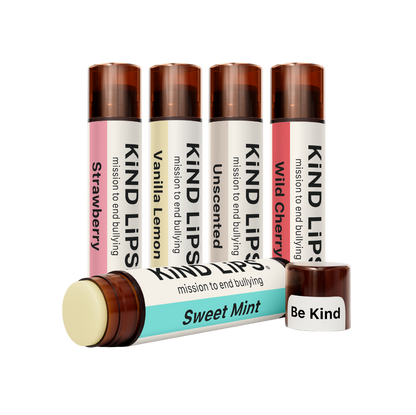 Assorted organic lip balm tubes from Kind Lips Variety Pack, showing colorful packaging and labels of the lip care products.