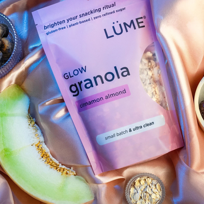 LÜME Cinnamon Almond Granola in a package with cinnamon and almond flavoring visible on the label