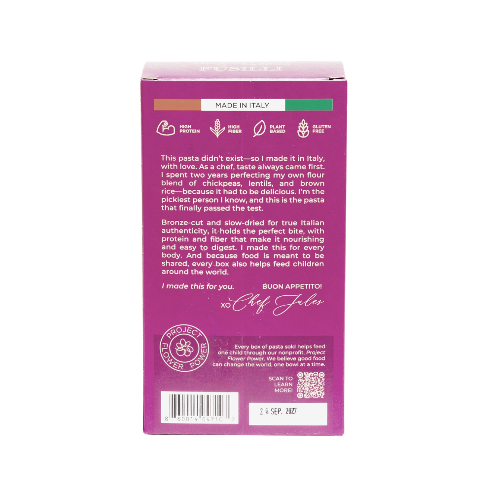 Flower Chef Foods high protein fusilli pasta, uncooked, showing a close-up of the spiral-shaped pasta on a white background.