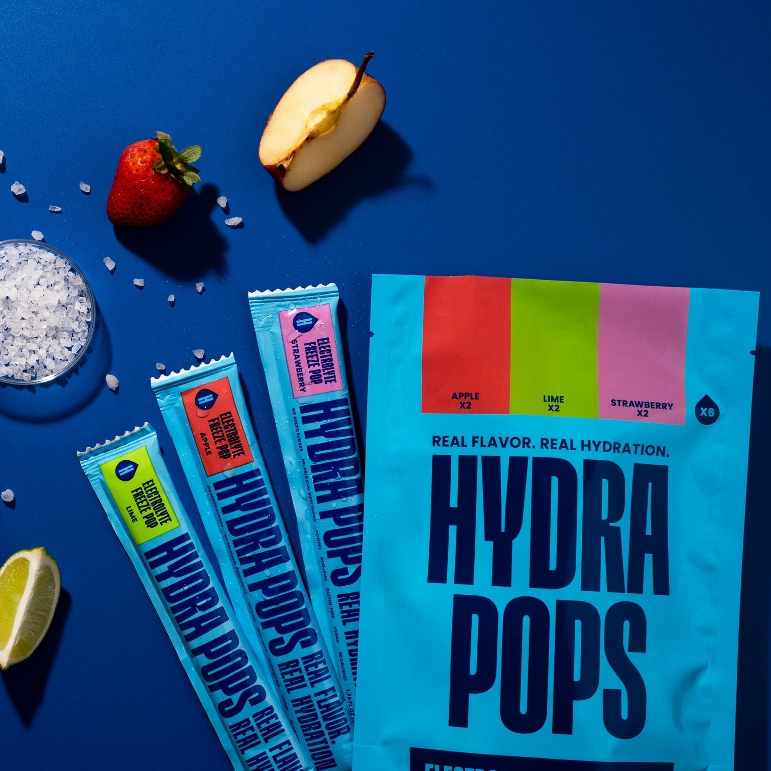 Assorted Hydra Pops hydrating icy pops in a variety pack with colorful flavors and packaging, by Hydra Hydration.
