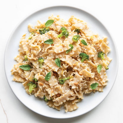 Jovial Gluten Free Brown Rice Mafalda pasta in a bowl, showcasing the light, yellowish pasta strands made from brown rice.