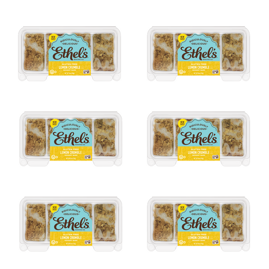Ethel's Lemon Crumble Bar from Ethels Baking Company, with a golden lemon crumble topping on a white plate.