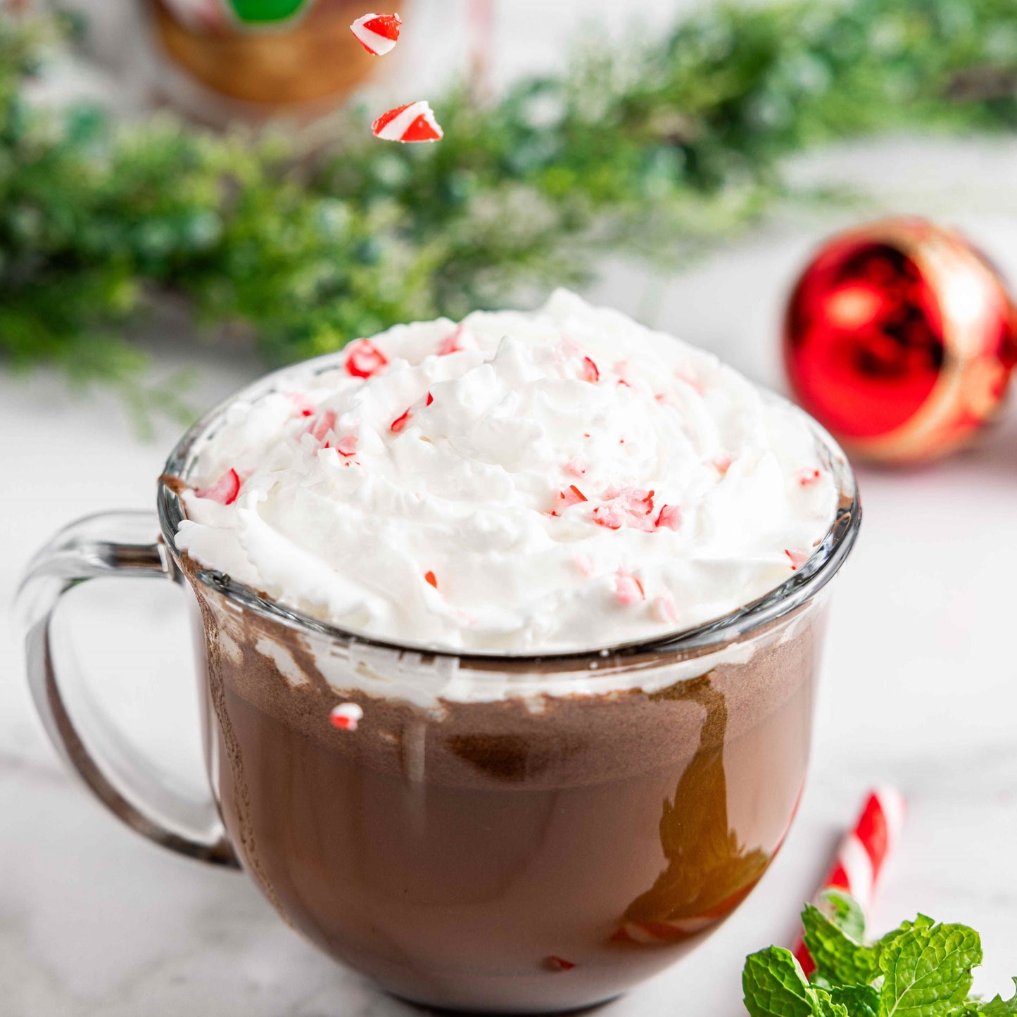 Bare Life dairy-free peppermint hot cocoa mix in a 5-pack, gluten-free paleo chocolate with candy cane flavor, ready to enjoy.