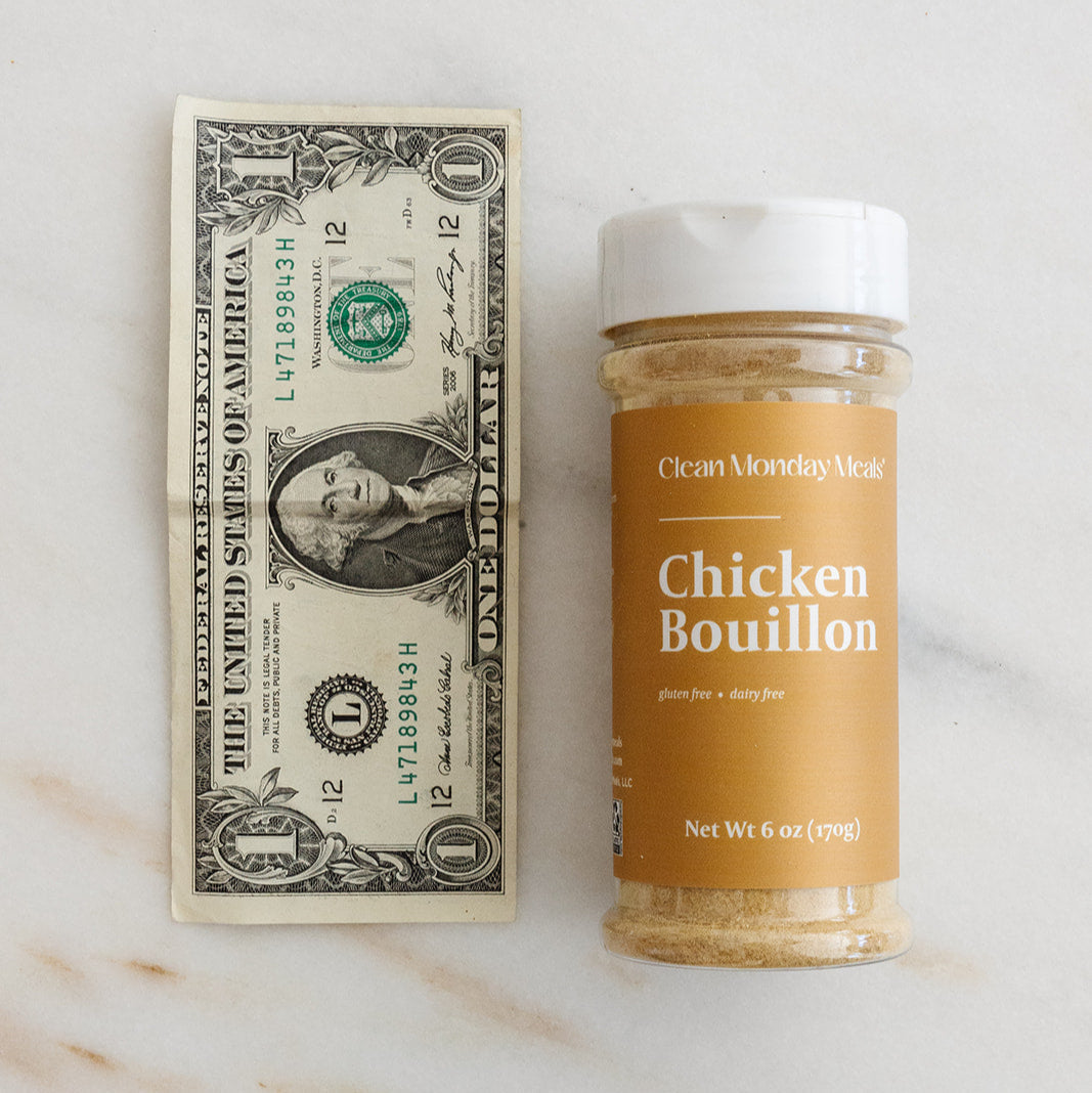 Clean Monday Meals Chicken Bouillon seasoning in a jar, showing the label and seasoning granules on the container.