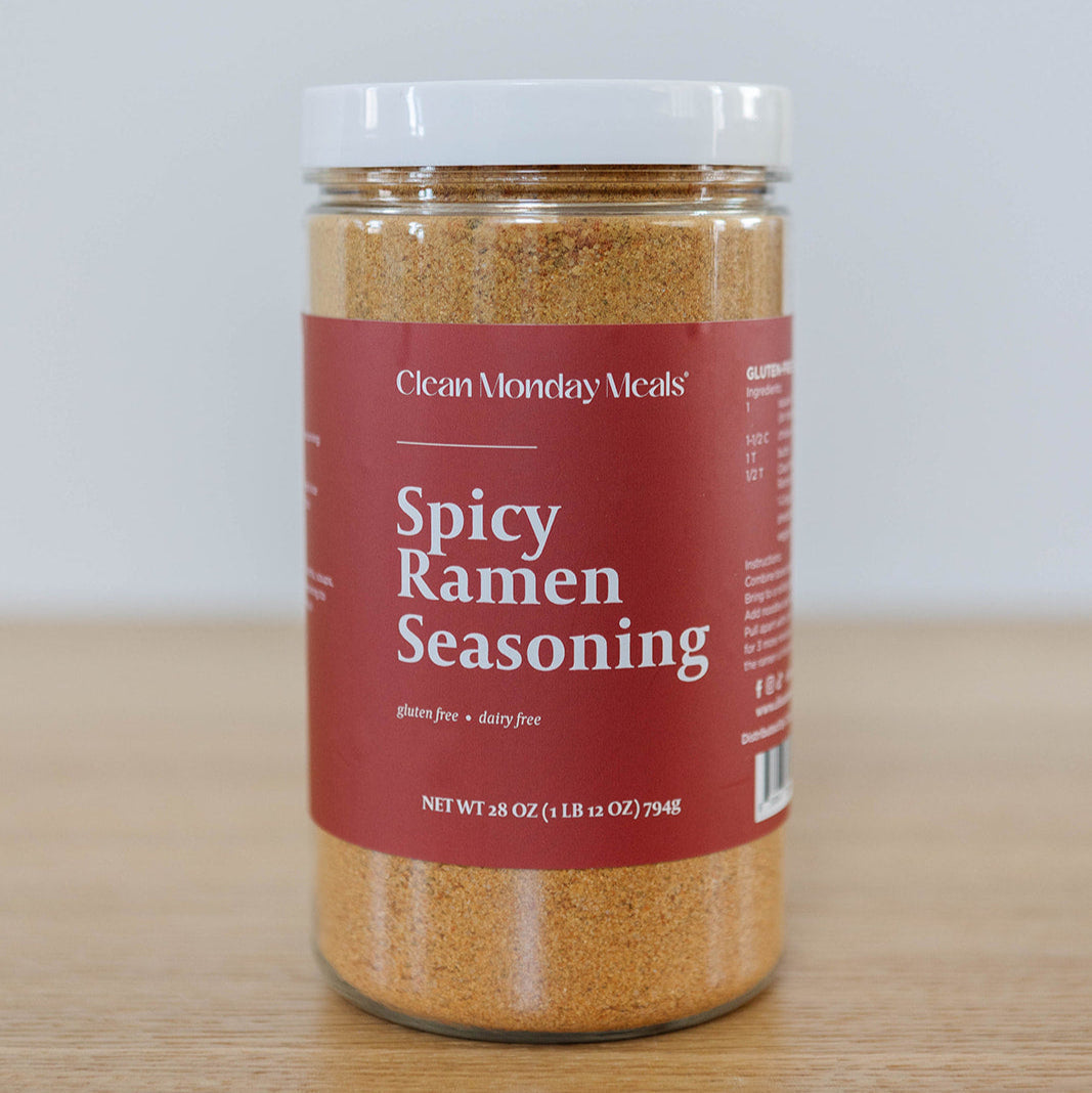 Spicy ramen seasoning packet from Clean Monday Meals with vibrant red and orange packaging, ready for flavor enhancement.