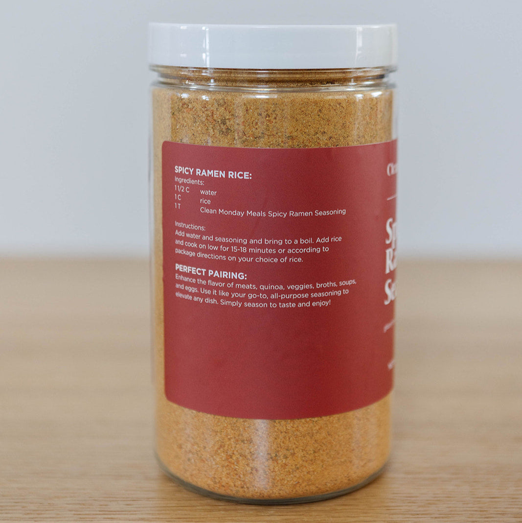 Spicy ramen seasoning packet from Clean Monday Meals, featuring vibrant red powder in a clear plastic bag.