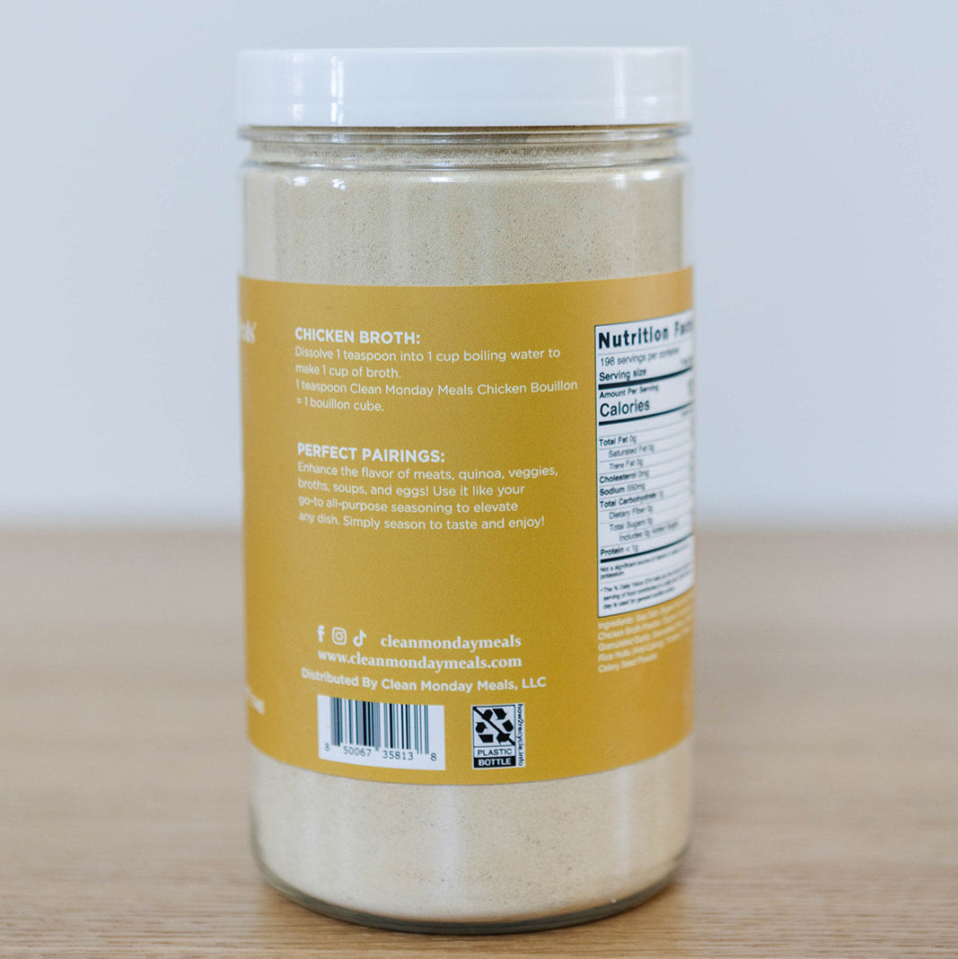 Clean Monday Meals chicken bouillon seasoning in a jar, highlighting the seasoning's texture and label on the container.