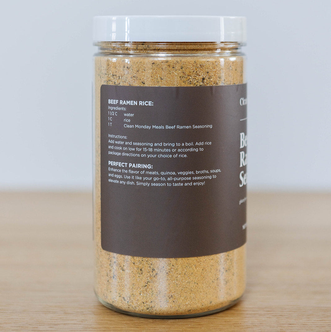 Close-up of Clean Monday Meals Beef Ramen Seasoning container with label showing seasoning blend and ingredients.