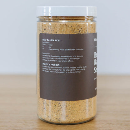 Close-up of Clean Monday Meals Beef Ramen Seasoning container with label showing seasoning blend and ingredients.