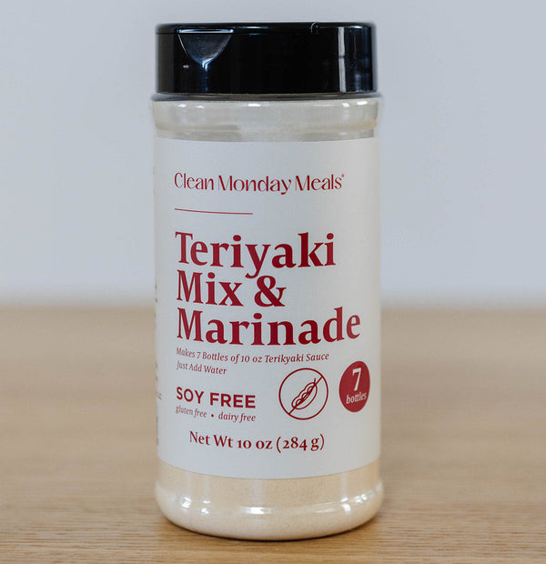Clean Monday Meals soy-free teriyaki mix and marinade in a clear container, ready for cooking or grilling.