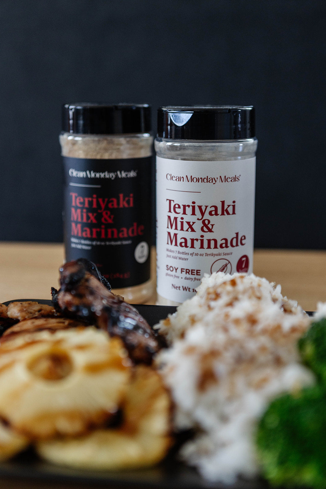 Soy-free teriyaki mix and marinade by Clean Monday Meals, shown in a clear container with a glossy, flavorful sauce appearance.
