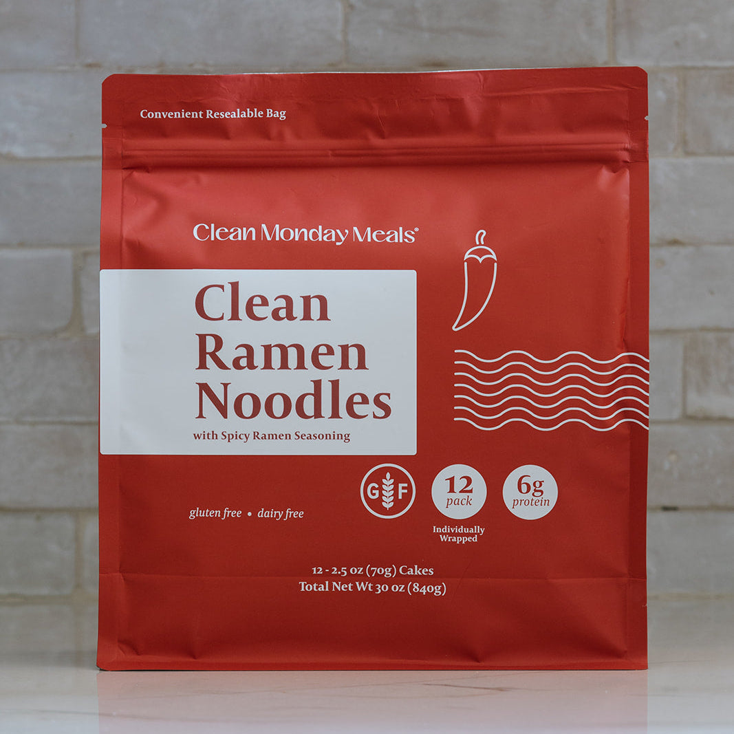 Bowl of Clean Monday Meals ramen noodles with vegetables and broth, showcasing a flavorful Asian-inspired ramen dish.