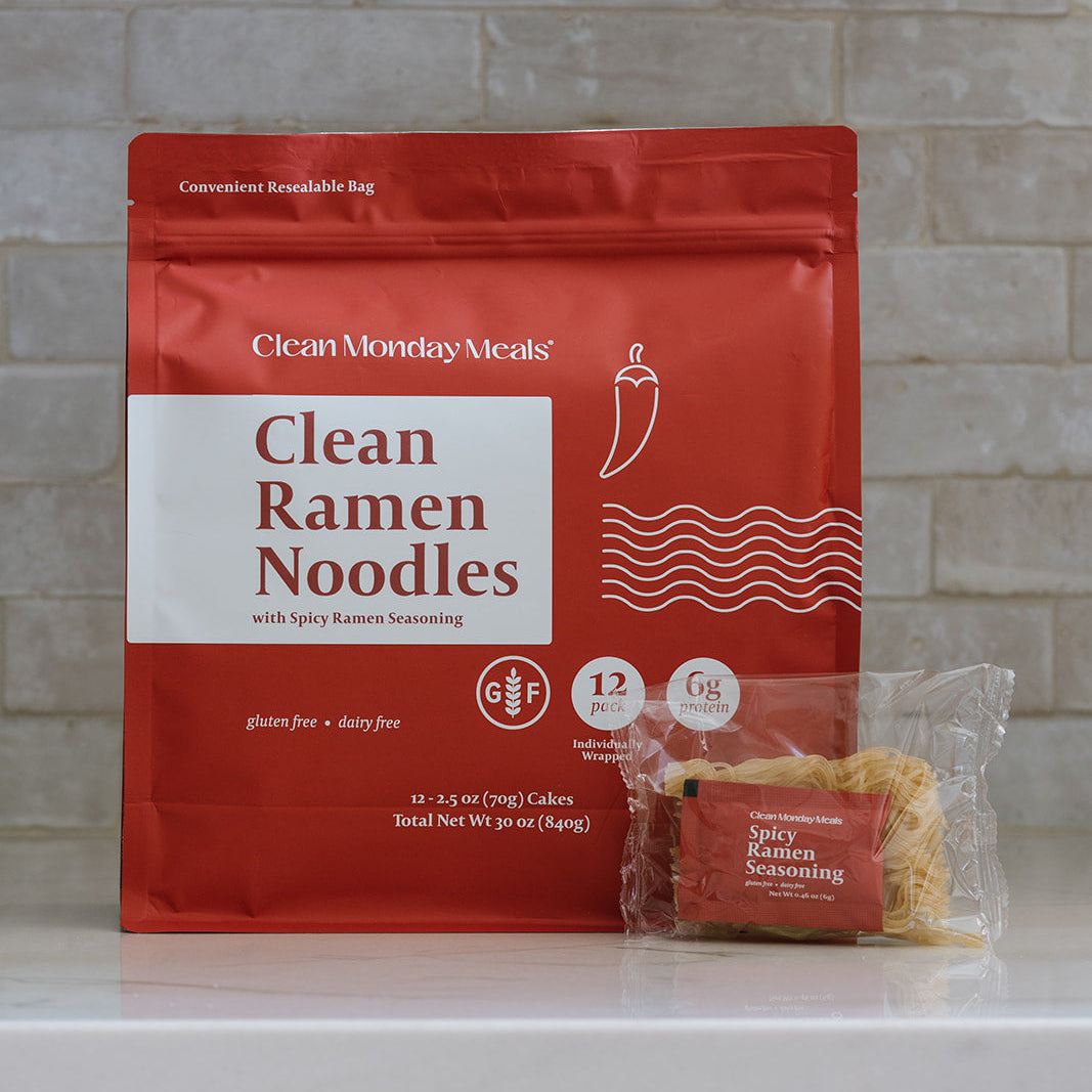 Bowl of Clean Monday Meals ramen noodles with vegetables and broth, showcasing a delicious and hearty Asian-inspired dish.