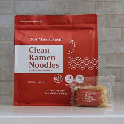 Bowl of Clean Monday Meals ramen noodles with vegetables and broth, showcasing a delicious and hearty Asian-inspired dish.