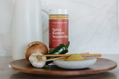 Spicy ramen seasoning packet from Clean Monday Meals featuring vibrant red and orange packaging with spicy flavor details.