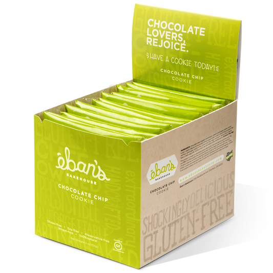 Open packaging of Eban’s Bakehouse chocolate chip cookies, showing a batch of freshly baked, golden-brown cookies with chocolate chips.