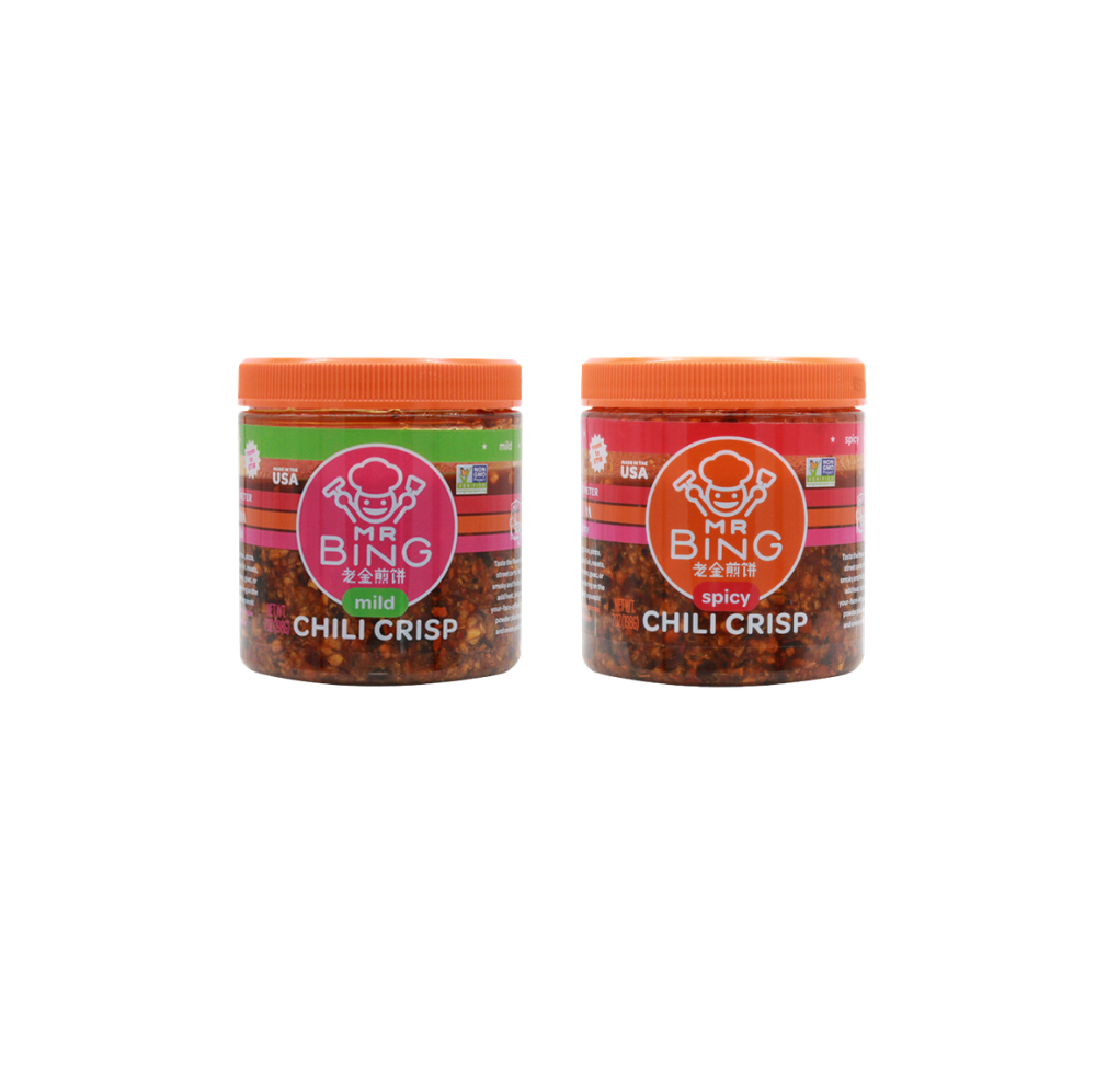 Two 7oz jars of Mr Bing Chili Crisp from Mr Bing Foods, showing the jar labels and spicy chili oil inside