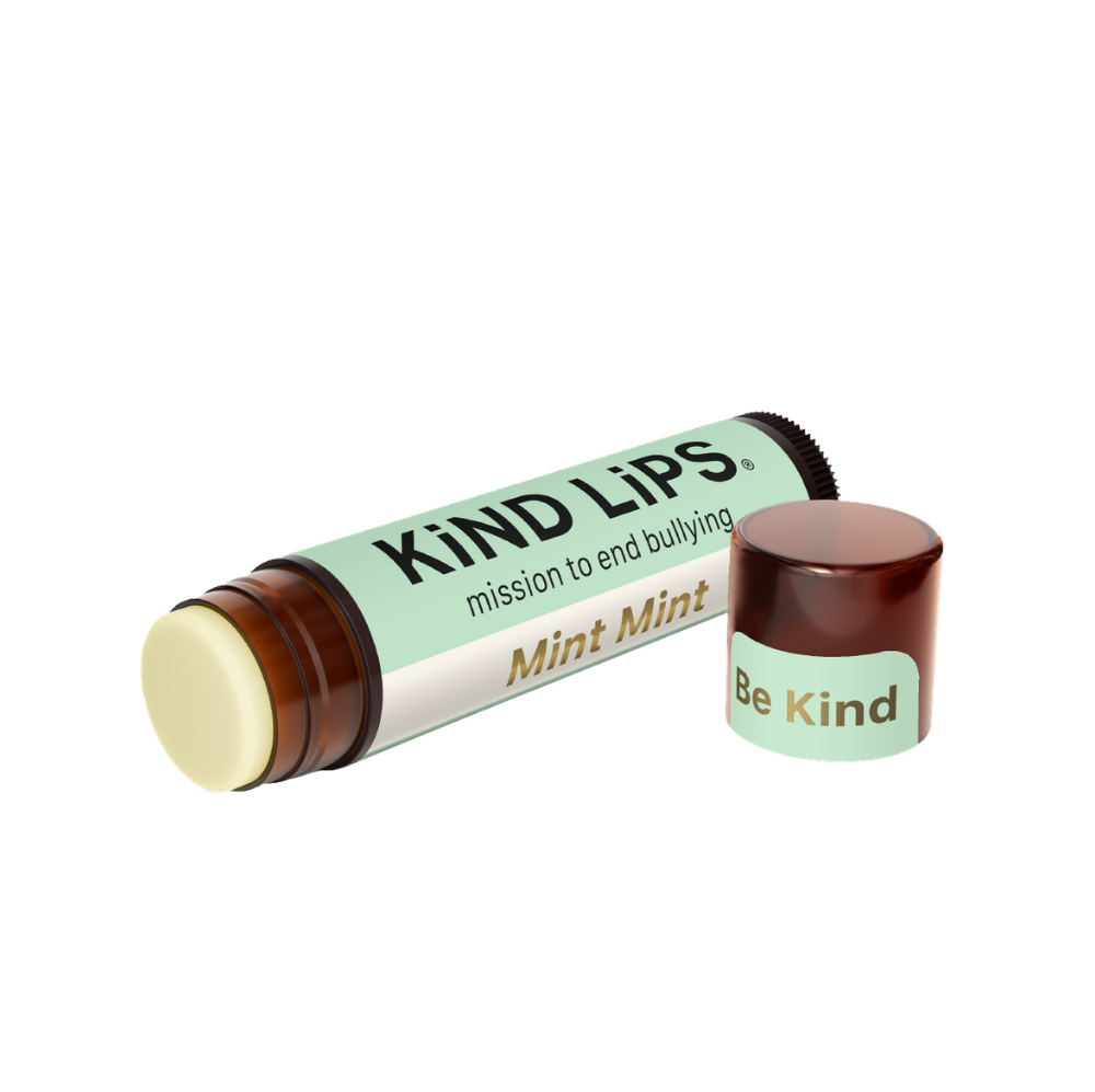 Organic mint lip balm by Kind Lips, showing a tube with mint-flavored balm and natural packaging on a white background.