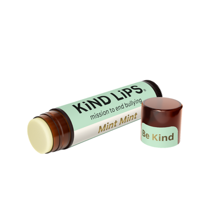 Organic mint lip balm by Kind Lips, showing a tube with mint-flavored balm and natural packaging on a white background.