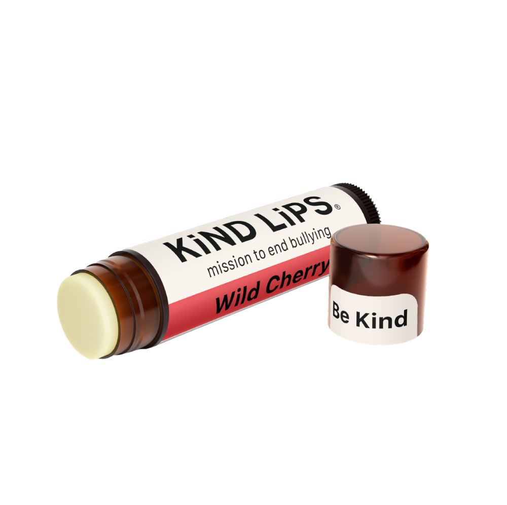 Kind Lips Wild Cherry Organic Lip Balm in a small tube, showcasing the natural product with cherry flavor and organic ingredients.