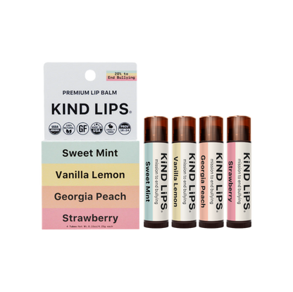 Assorted organic lip balms from Kind Lips in a 4-pack, featuring natural ingredients and colorful packaging.
