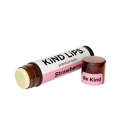 Kind Lips Strawberry organic lip balm tube with natural strawberry scent and clear branding, displayed on a white background.