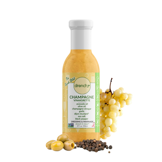 Drench Champagne Vinaigrette bottle with label showing, standing upright on a white background, close-up view.