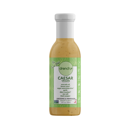 Drench Vegan Caesar dressing bottle with label, showcasing creamy texture and vibrant packaging on a white background.