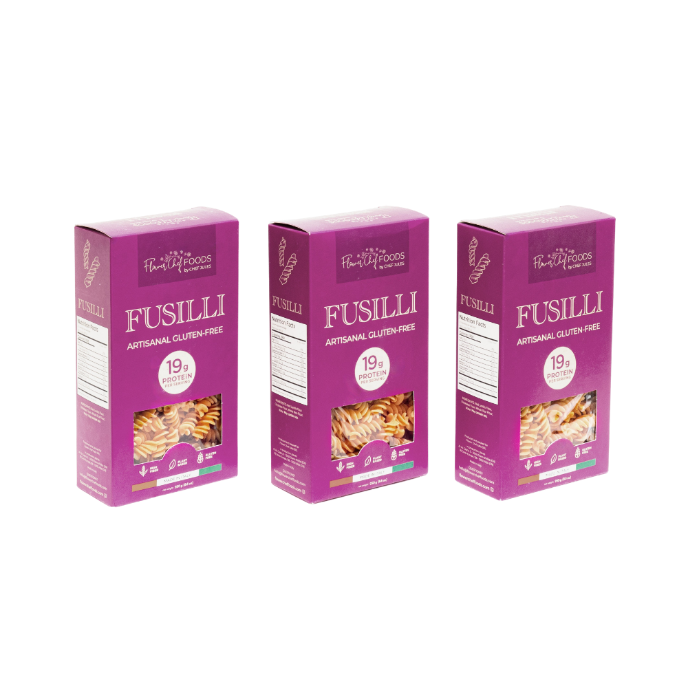 Pack of three artisanal gluten-free, high-protein fusilli pasta by Flower Chef Foods, arranged in a clear view.
