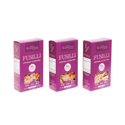 Three packs of Flower Chef Foods artisanal gluten-free high-protein fusilli pasta on a white background.