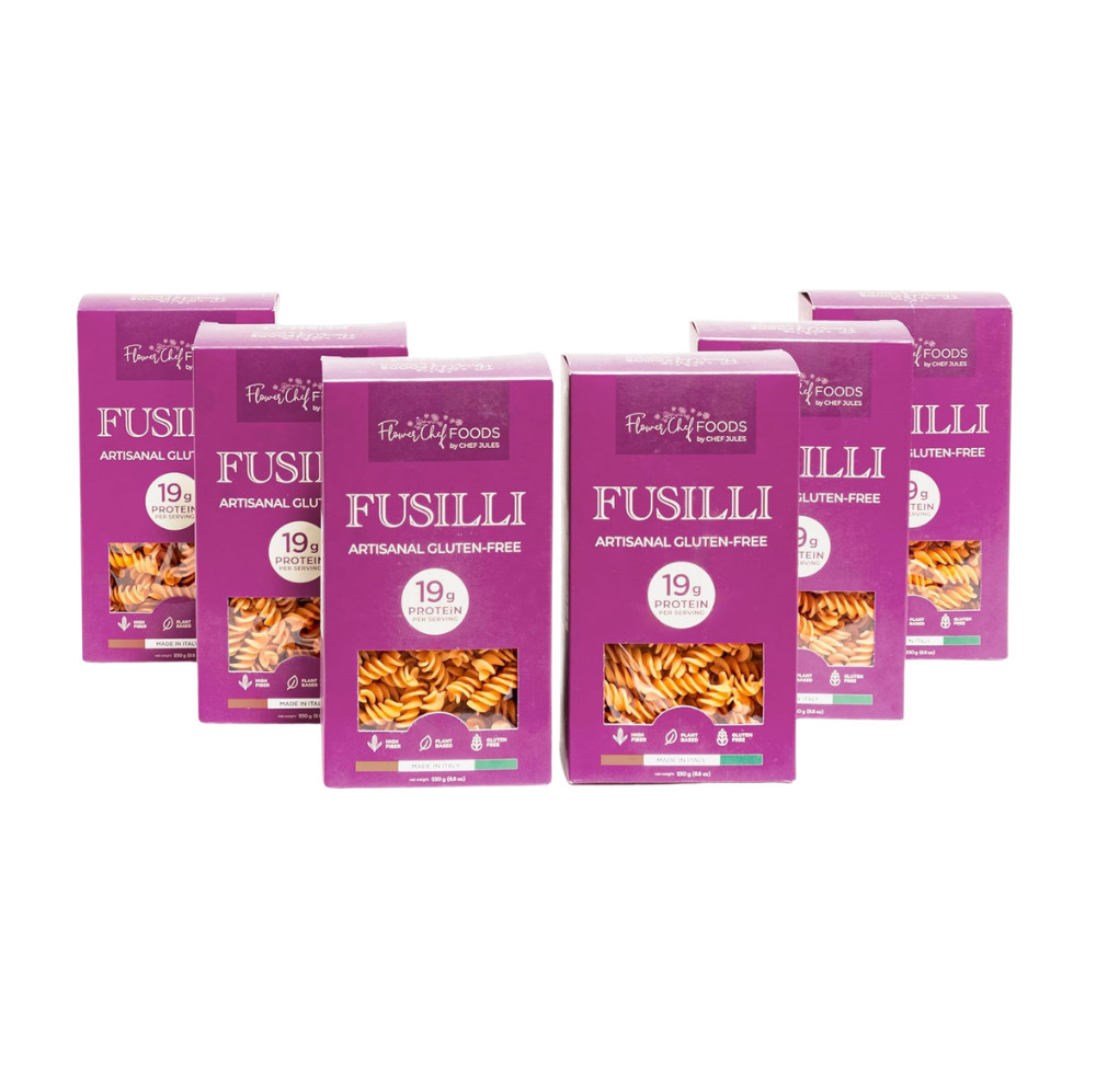Six-pack of Flower Chef Foods gluten-free high-protein fusilli pasta in clear packaging, ready for cooking.