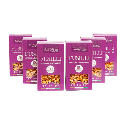 Six-pack of Flower Chef Foods gluten-free high-protein fusilli pasta in clear packaging, ready for cooking.