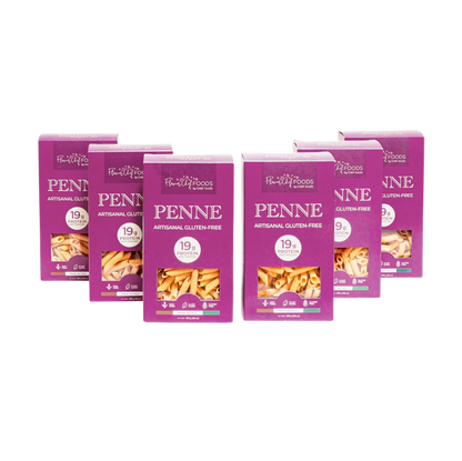 Six-pack of Flower Chef Foods gluten-free, high-protein penne pasta in a clear display, showcasing the pasta's texture and shape.