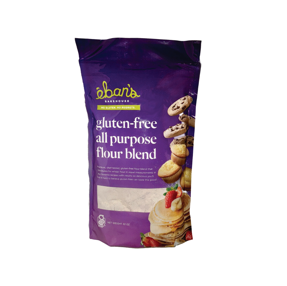Eban’s Bakehouse gluten free all purpose flour blend in a 2lb bag, with a scoop of flour and baking ingredients on a wooden surface.