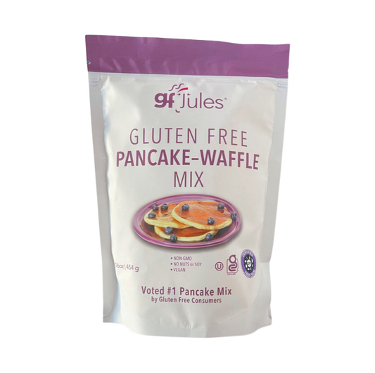 gfJules gluten-free pancake and waffle mix in a colorful box with a prepared stack of pancakes topped with syrup and fruit.