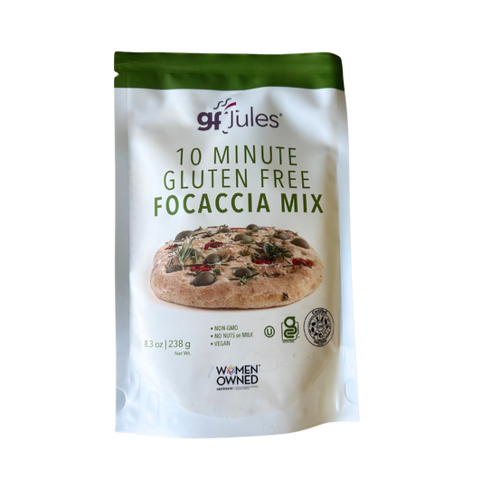 gfJules gluten-free focaccia mix in a bowl, showing the ready-to-bake focaccia dough with herbs and olive oil on top.