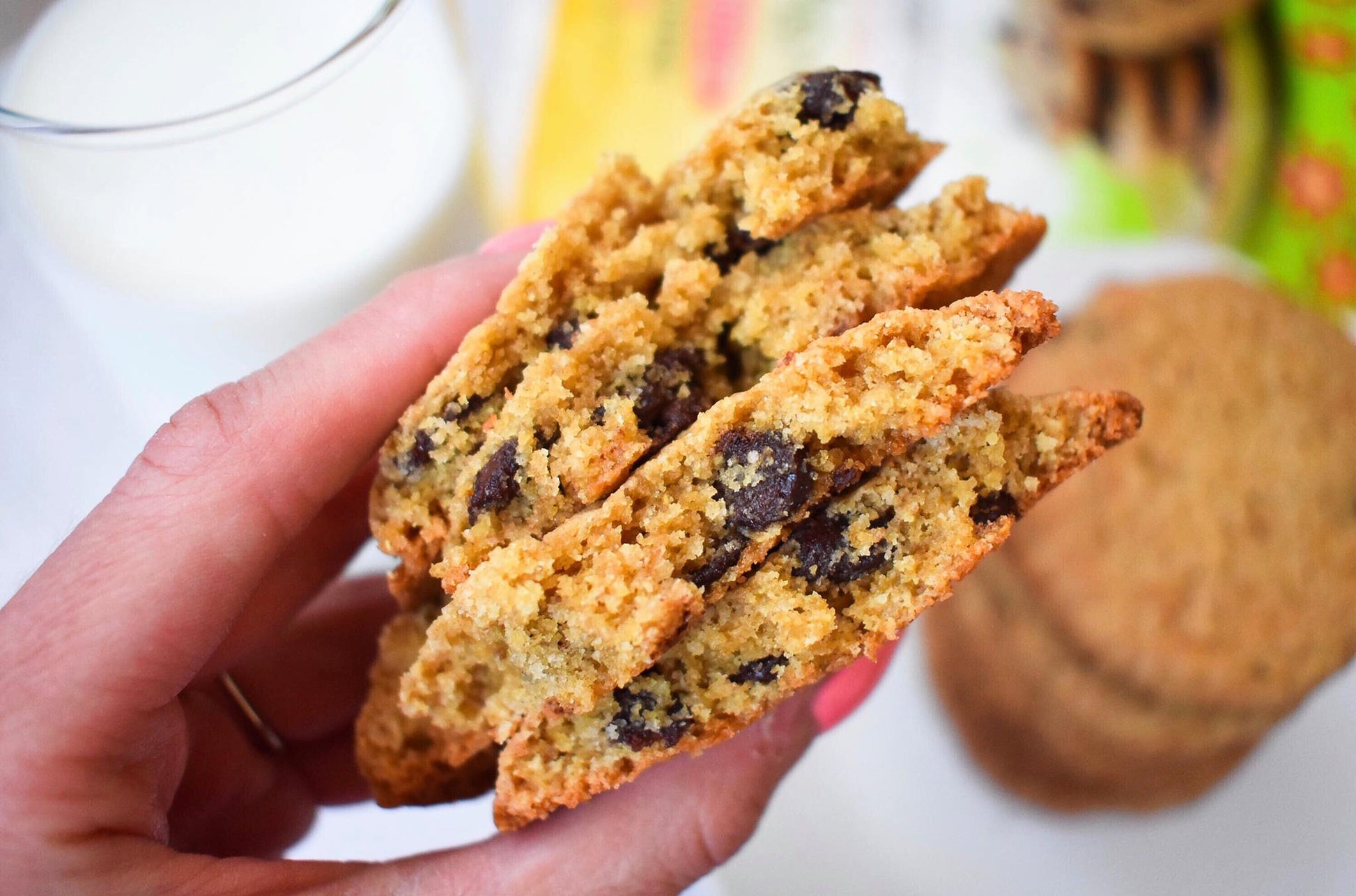 Jessica's Natural Foods chocolate chip cookie mix with prepared cookies featuring chocolate chips on a baking sheet.