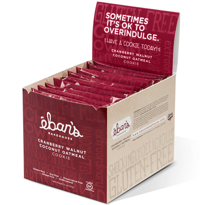 Open packaging of Eban’s Bakehouse cranberry walnut coconut oatmeal cookies, showing the freshly baked cookies with cranberries, walnuts, and oats.