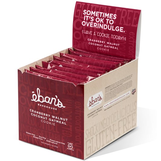Open package of Eban’s Bakehouse cranberry walnut coconut oatmeal cookies showing cookies with cranberries, walnuts, and coconut flakes.
