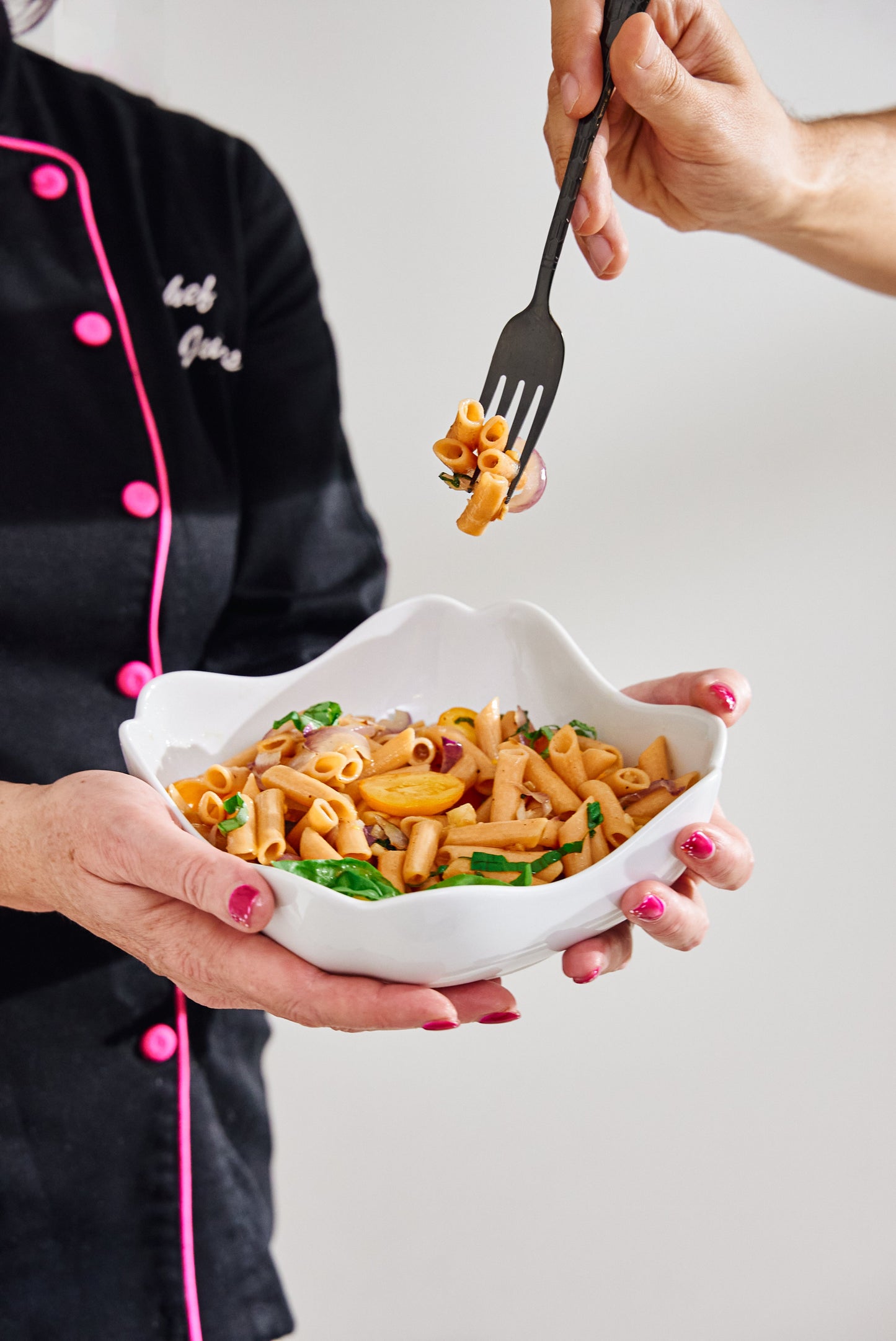 High protein Flower Chef Foods Penne pasta in a bowl, showcasing the cooked, textured pasta with a vibrant background.