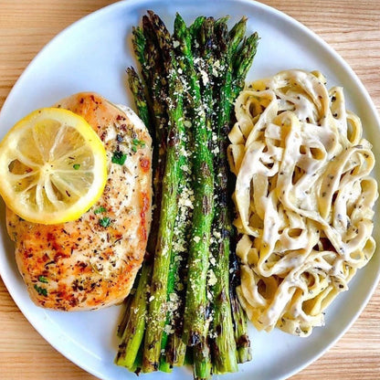 Fresh gluten-free fettuccine pasta from Taste Republic Gluten-Free, displayed in a 6-pack package with cooked fettuccine on a plate.