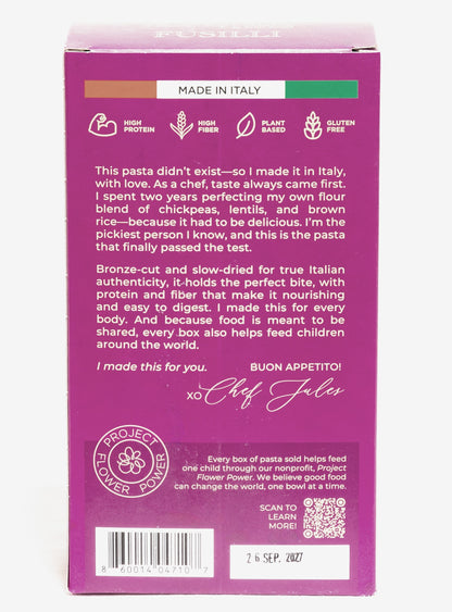 Back view of Flower Chef Foods gluten-free, high protein fusilli pasta pack of 3, showcasing the pasta's corkscrew shape in a clear bag.