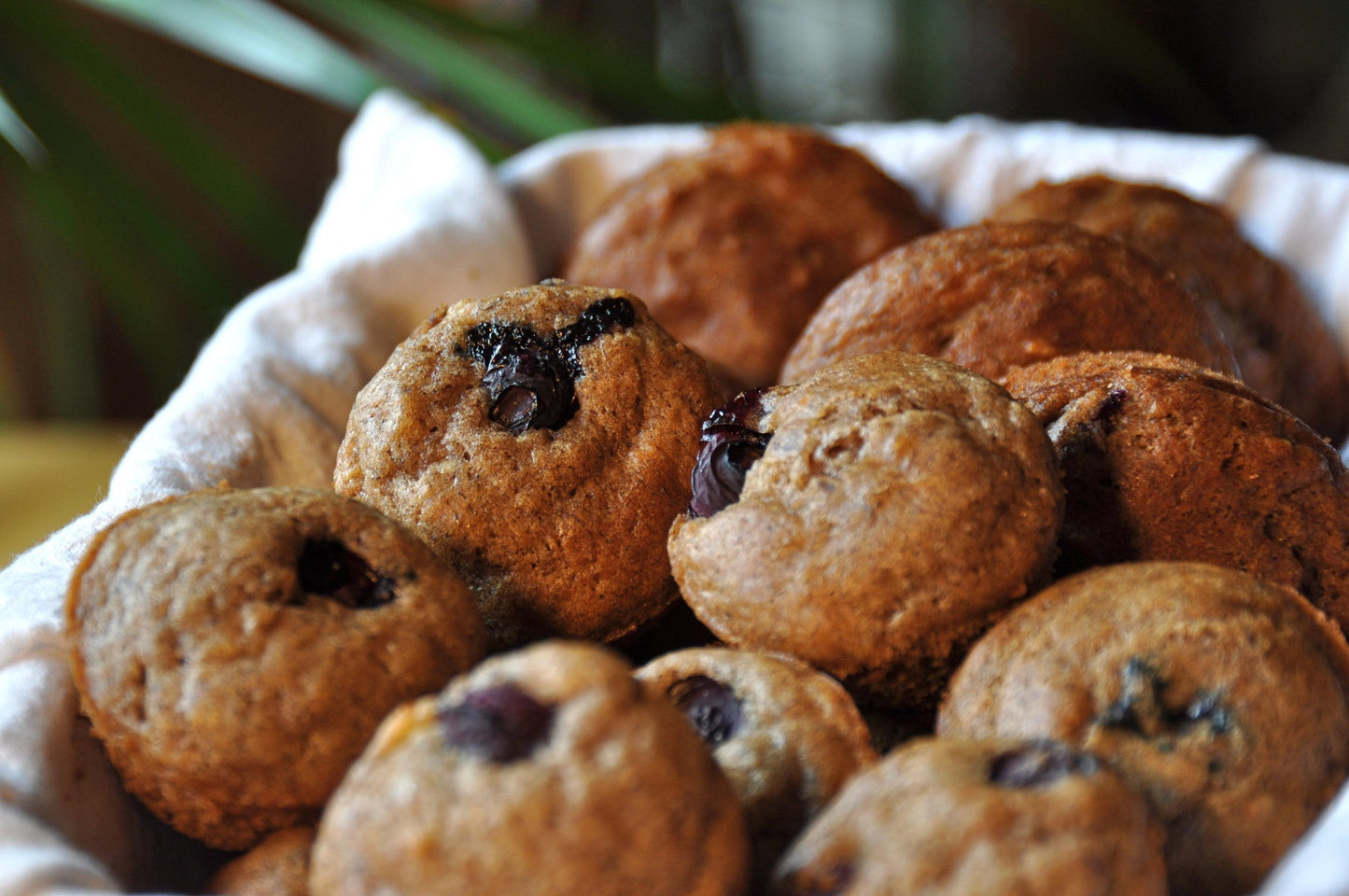 Gluten-free gfJules muffin mix in a bowl with baking ingredients, ready for baking, showcasing the product packaging.