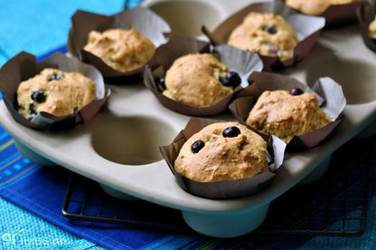 Gluten-free muffin mix by gfJules in a package, showing golden baked muffins with a soft, fluffy texture.